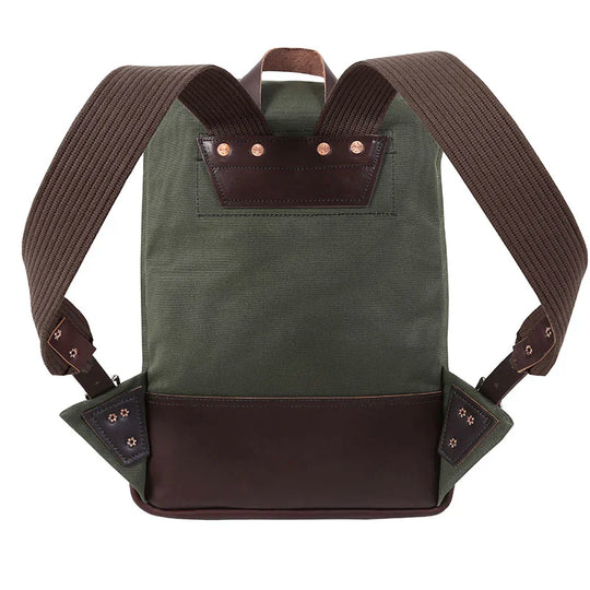 Deluxe Roll-Top Scout Pack in Olive Drab with leather accents, showcasing durable canvas and thick padded straps ideal for rugged outdoor use by Duluth Pack.