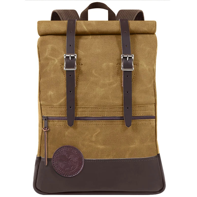 Deluxe Roll-Top Scout Pack in waxed khaki canvas and leather, handmade by Duluth Pack, designed for rugged outdoor use and durable everyday adventures.