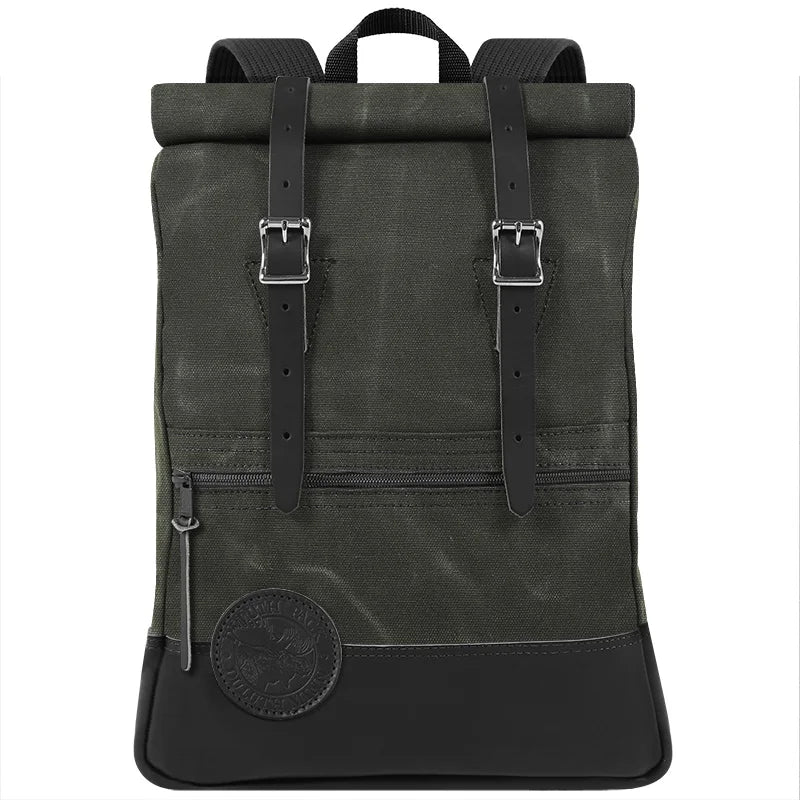Deluxe Roll-Top Scout Pack in Waxed Olive Drab canvas with leather straps, showcasing durable, handmade craftsmanship perfect for rugged outdoor use.