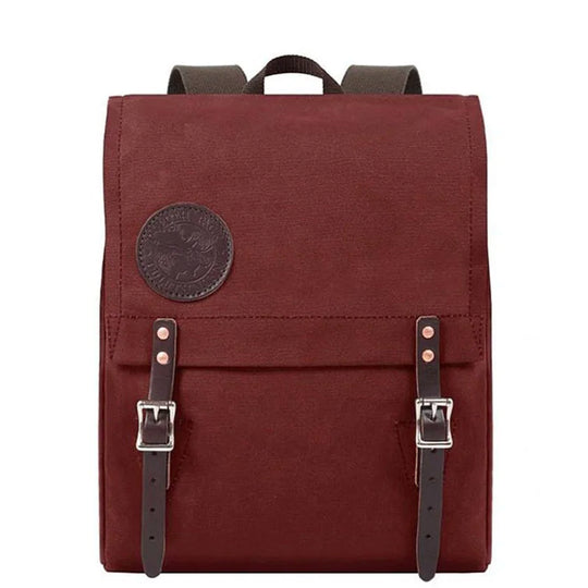 Ranger Pack in burgundy canvas with premium leather flap straps, designed for rugged outdoor use by Duluth Pack.