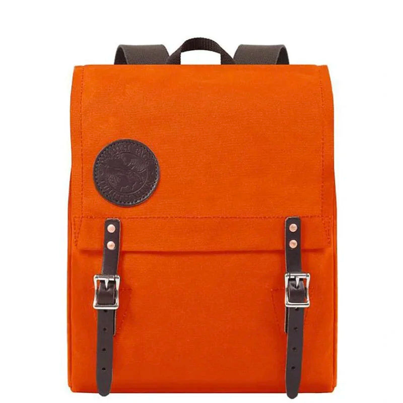 Ranger Pack in vibrant orange featuring rugged canvas construction and premium leather straps, designed for durable everyday outdoor use by Duluth Pack.