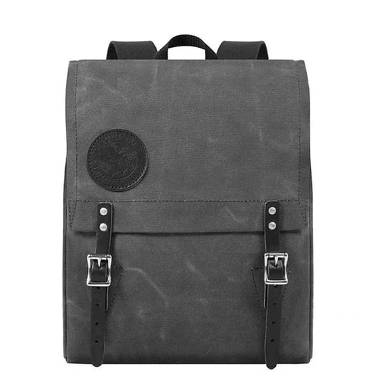 Ranger Pack in waxed grey canvas with premium leather flap straps and roller buckles, designed for rugged outdoor use and lasting durability.