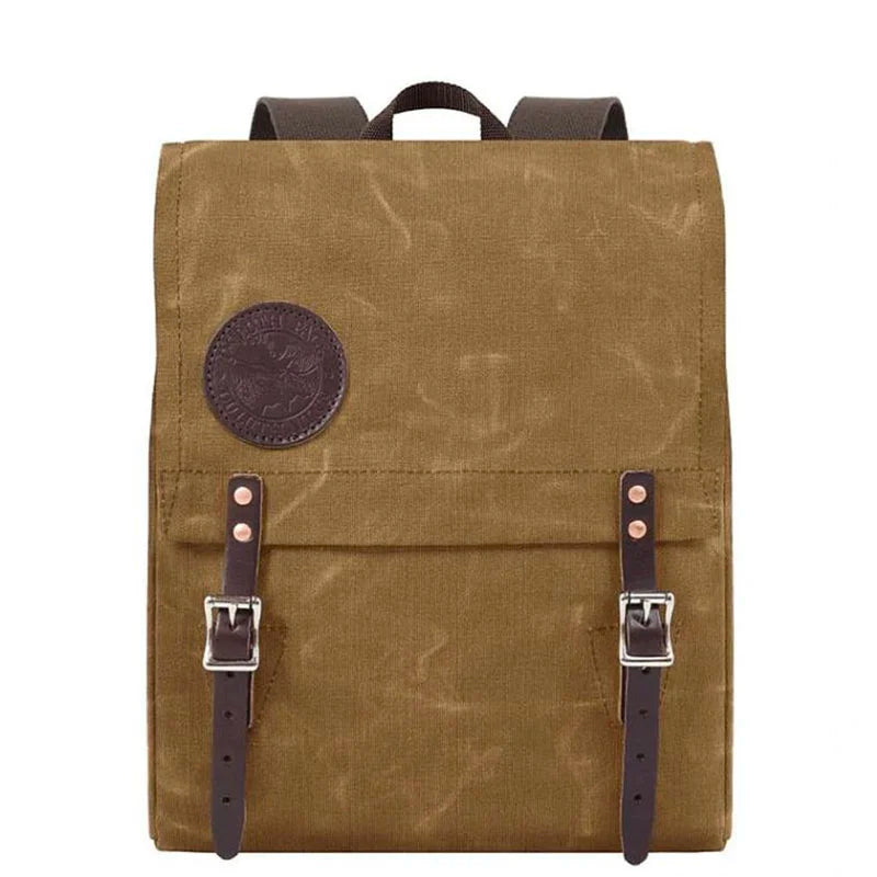 Ranger Pack in waxed khaki with premium leather flap straps and rugged canvas construction, perfect for durable outdoor adventures by Duluth Pack.