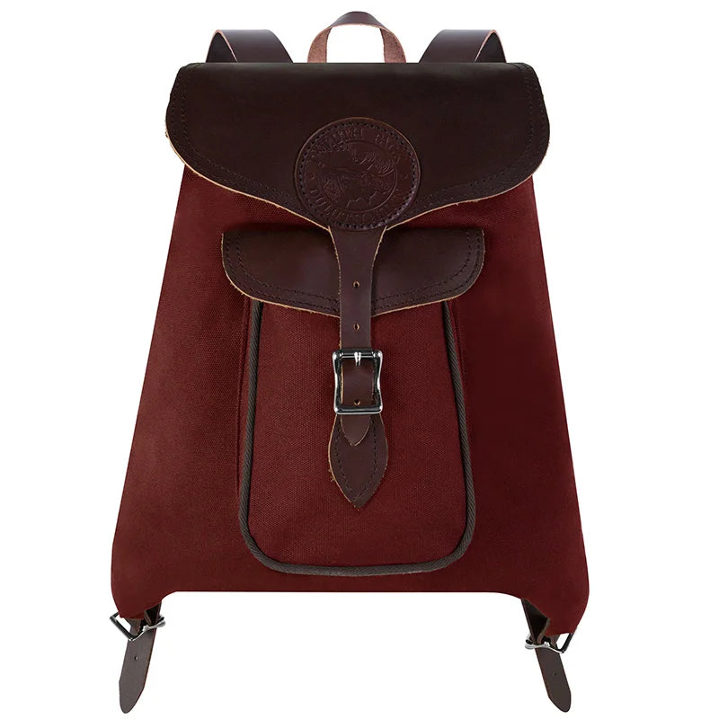 Rucksack Backpack in rugged waxed canvas and leather with buckle closure, crafted by Duluth Pack for durable outdoor and everyday use.