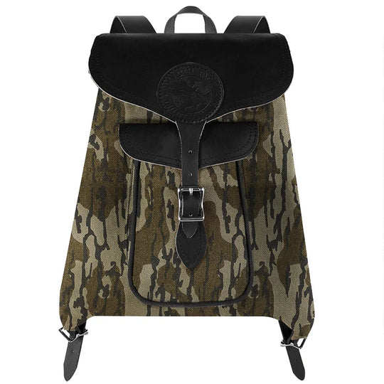 Rucksack Backpack in rugged waxed canvas with leather straps featuring a camouflage pattern, designed for durable outdoor use by Duluth Pack.