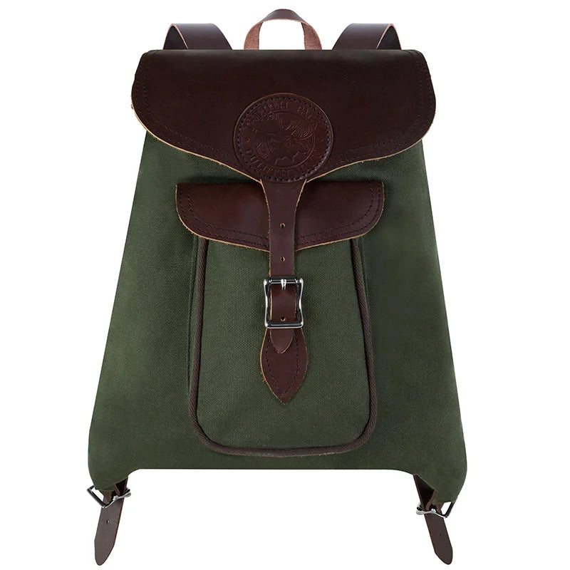 Rucksack Backpack in rugged waxed green canvas with reinforced leather straps and closure, crafted by Duluth Pack for durable outdoor and everyday use.