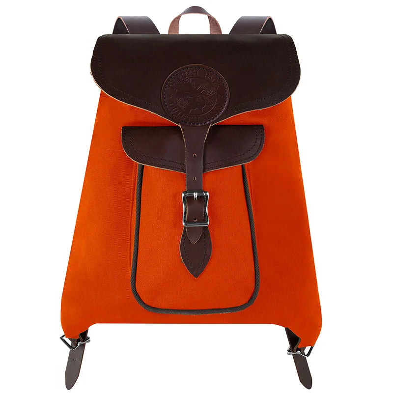 Rucksack Backpack in rugged orange waxed canvas with reinforced leather straps, designed for durable outdoor use and everyday reliability by Duluth Pack.