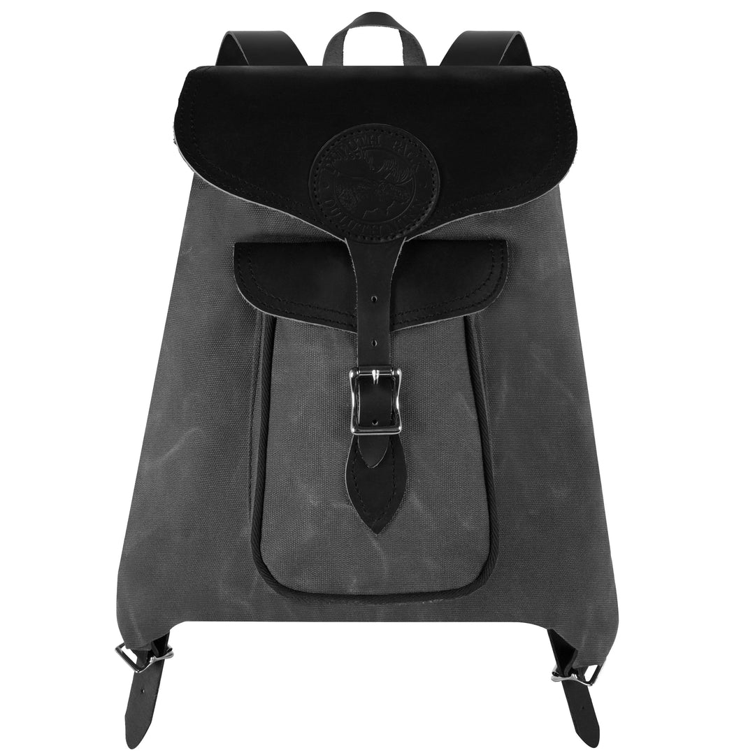 Rucksack Backpack in rugged waxed canvas with black leather straps, designed for durable outdoor use and everyday reliability by Duluth Pack.