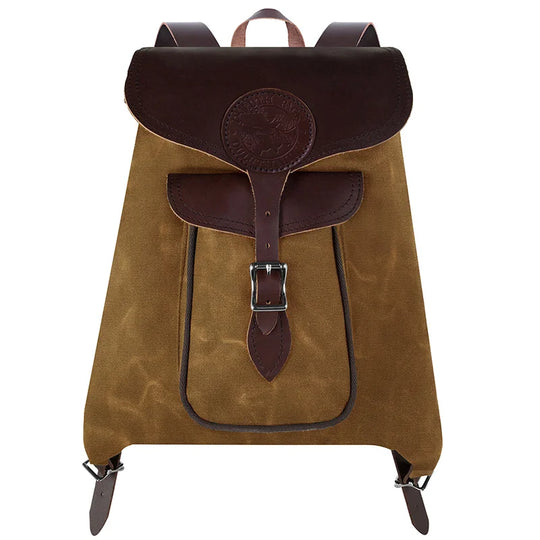 Rucksack Backpack in rugged waxed canvas with reinforced leather straps by Duluth Pack, designed for durable outdoor and everyday use.