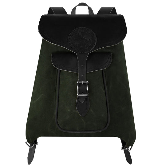 Rucksack Backpack in rugged waxed olive canvas with black leather straps and buckles, designed by Duluth Pack for durable outdoor and everyday use.
