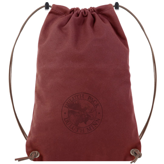 Drawstring Backpack in rich brown canvas with premium adjustable leather drawstrings, handcrafted by Duluth Pack for durable outdoor use and rugged performance.