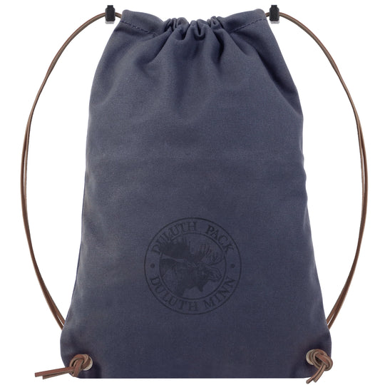 Drawstring Backpack in navy canvas with premium adjustable leather drawstrings, handcrafted by Duluth Pack for durable outdoor use and rugged everyday carry.