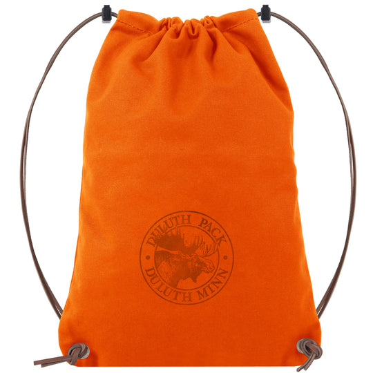 Drawstring Backpack in vibrant orange with premium leather drawstrings, handcrafted by Duluth Pack for durable outdoor use and rugged everyday adventures.