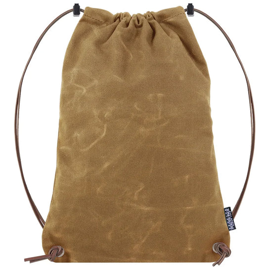 Drawstring Backpack in rugged waxed canvas with premium adjustable leather drawstrings by Duluth Pack, designed for durable outdoor use and everyday carry.