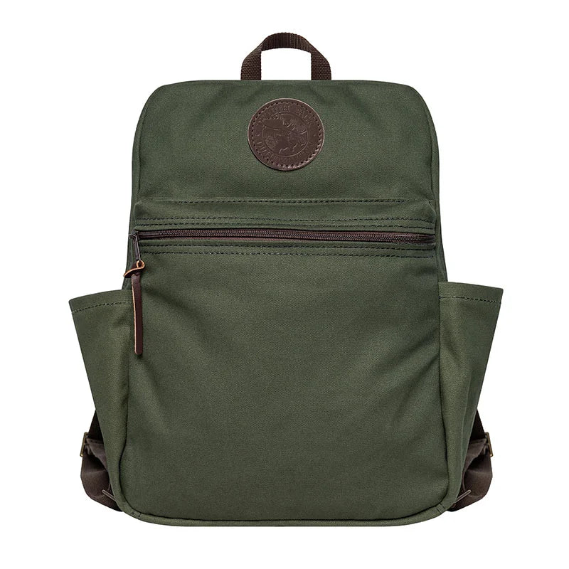 NEW Standard Backpack in Olive Drab canvas with leather accents, featuring side pockets and durable design for outdoor and school use by Duluth Pack.