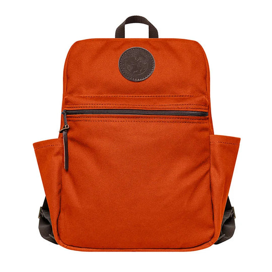 NEW Standard Backpack in orange with durable canvas and leather details, designed by Duluth Pack for rugged outdoor use and everyday school adventures.