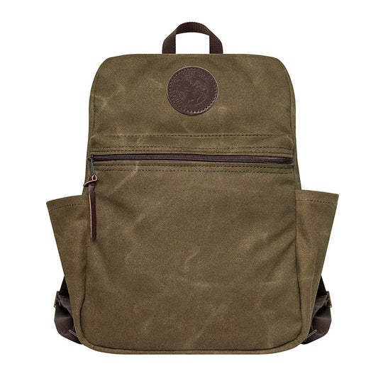 NEW Standard Backpack in waxed khaki canvas with side pockets and leather zipper pull, designed for durable everyday outdoor use by Duluth Pack heritage craftspeople.