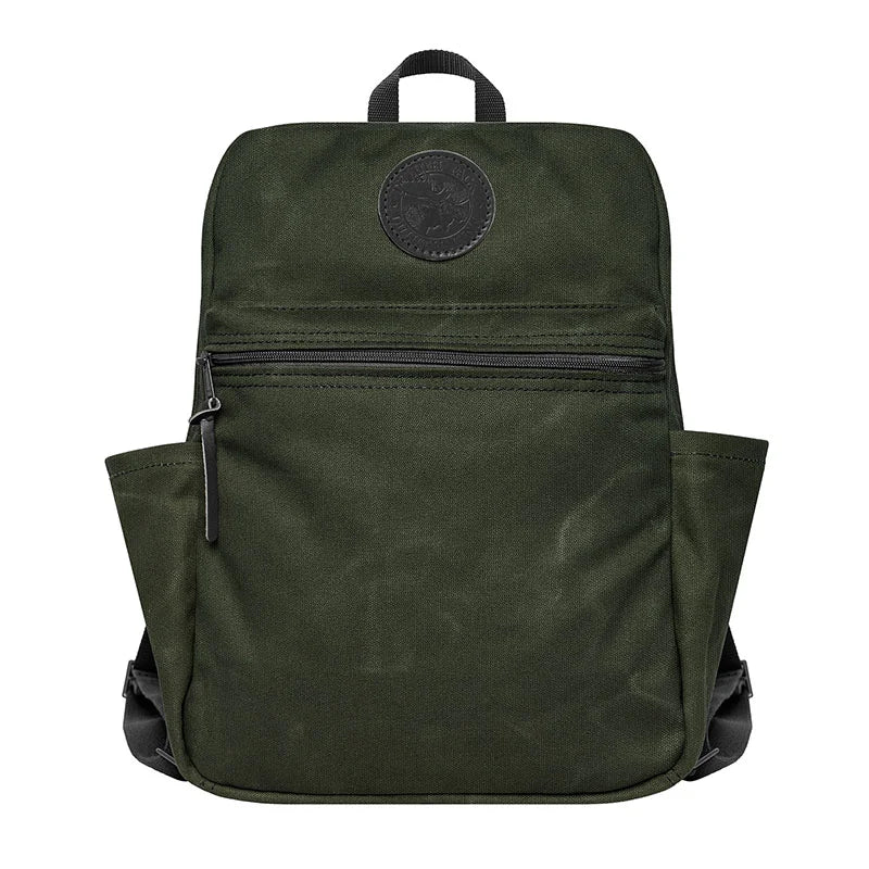 NEW Standard Backpack in Olive Drab by Duluth Pack, handmade waxed canvas with side pockets, designed for durable outdoor and school use.
