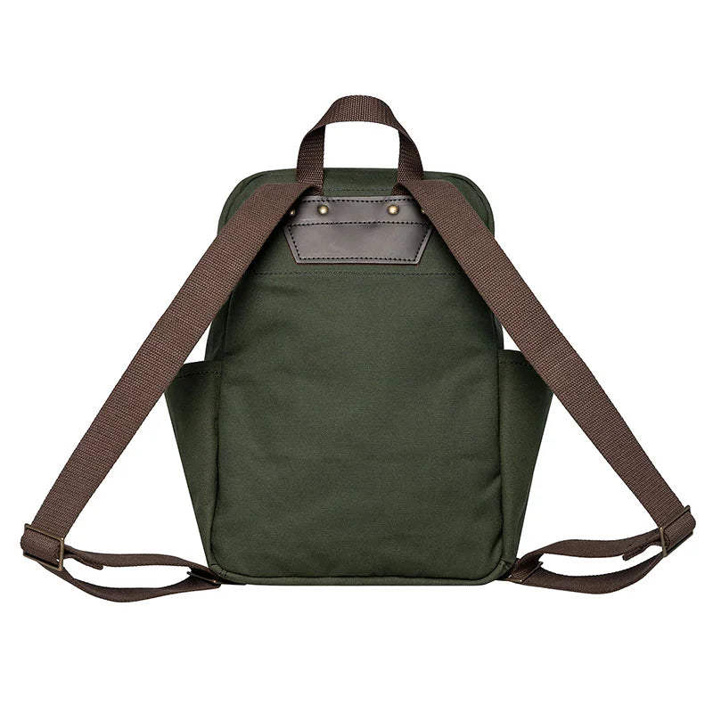 NEW Standard Backpack in Olive Drab with brown straps, handmade canvas and leather, durable outdoor gear by Duluth Pack shown from the back.
