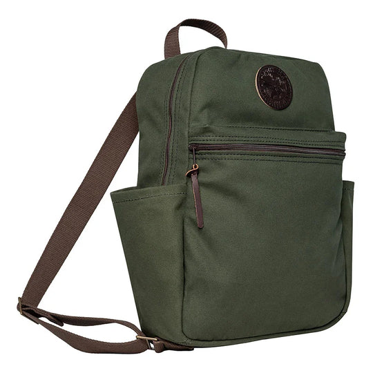 NEW Standard Backpack in Olive Drab color, featuring durable canvas material, side pockets for essentials, and a front zip compartment for everyday outdoor use.