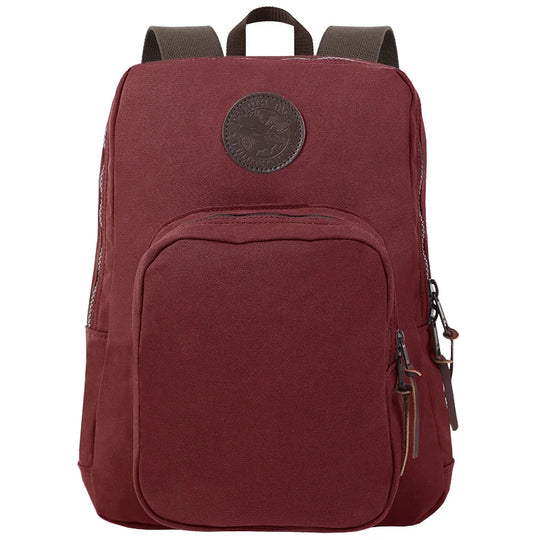 Large Standard Backpack in burgundy canvas with durable leather accents, designed by Duluth Pack for rugged outdoor use and lasting performance.