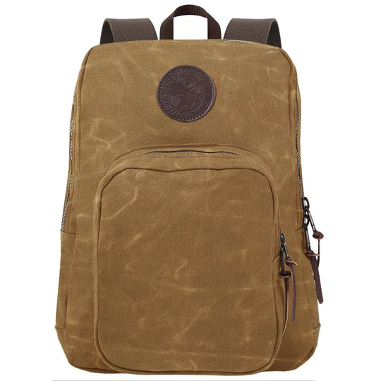 Large Standard Backpack in waxed khaki canvas with antique brass hardware, featuring durable construction and rugged outdoor style by Duluth Pack.