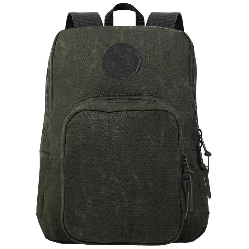 Large Standard Backpack in waxed olive drab canvas with durable brass hardware, featuring rugged construction ideal for outdoor use and everyday carry.