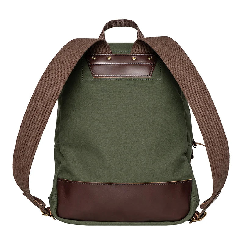 Large Standard Backpack in Olive Drab with leather backing and brown straps, handcrafted for rugged outdoor use by Duluth Pack.
