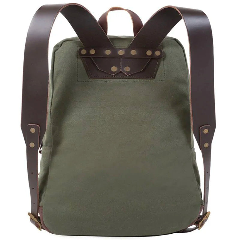 Deluxe Laptop Backpack in Olive Drab with rugged canvas and leather straps, designed by Duluth Pack for durable outdoor and everyday use.