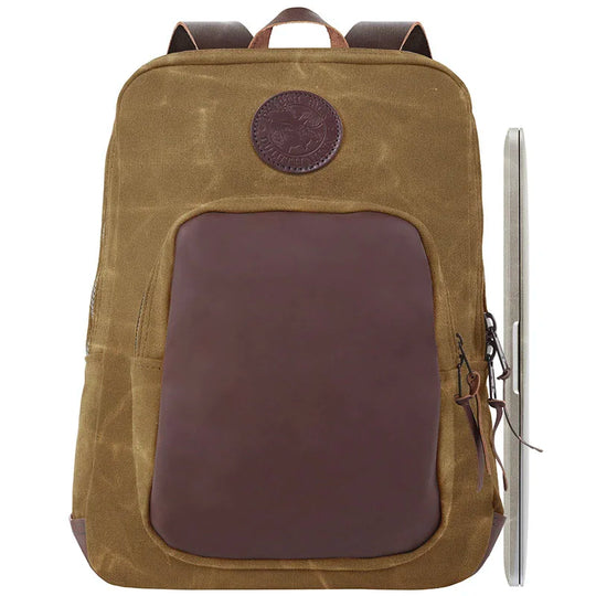 Deluxe Laptop Backpack in waxed khaki canvas with rich leather accents, featuring durable construction and practical design for rugged outdoor use by Duluth Pack.
