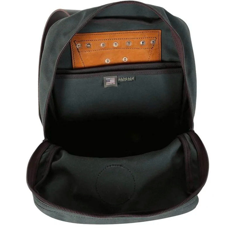 Deluxe Laptop Backpack in Waxed Olive Drab open to show roomy interior with durable canvas lining and leather detail pocket, crafted by Duluth Pack for rugged outdoor use.