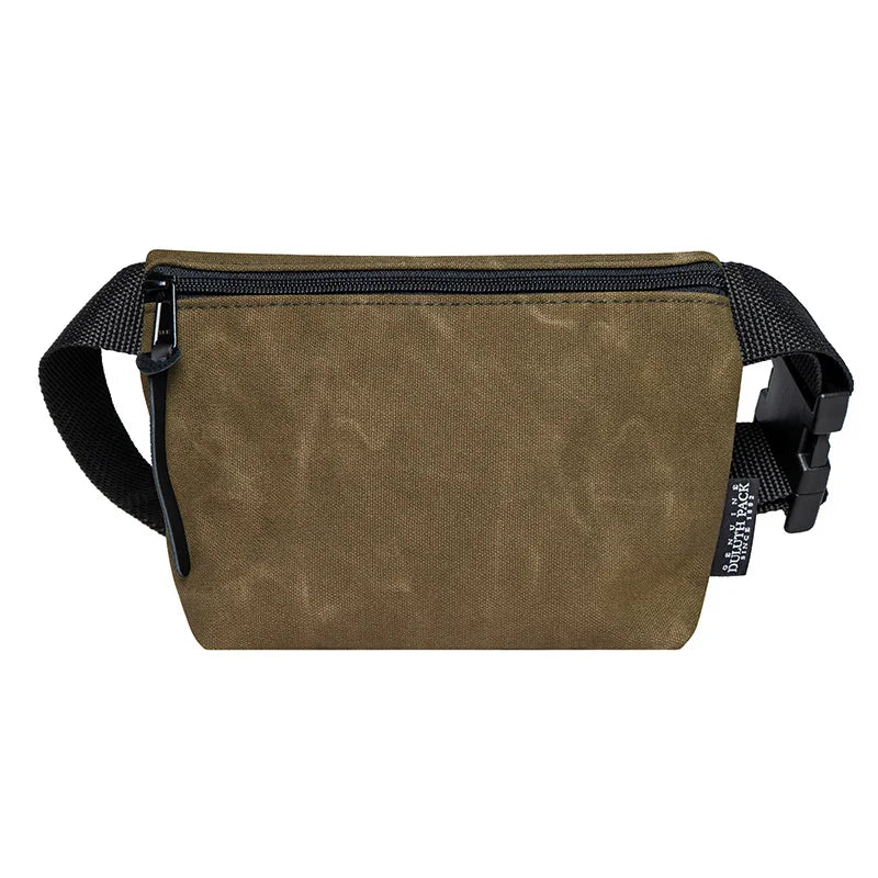 Mini Belt Bag in waxed khaki canvas with black adjustable strap, crafted by Duluth Pack for durable, hands-free carrying of essentials outdoors.