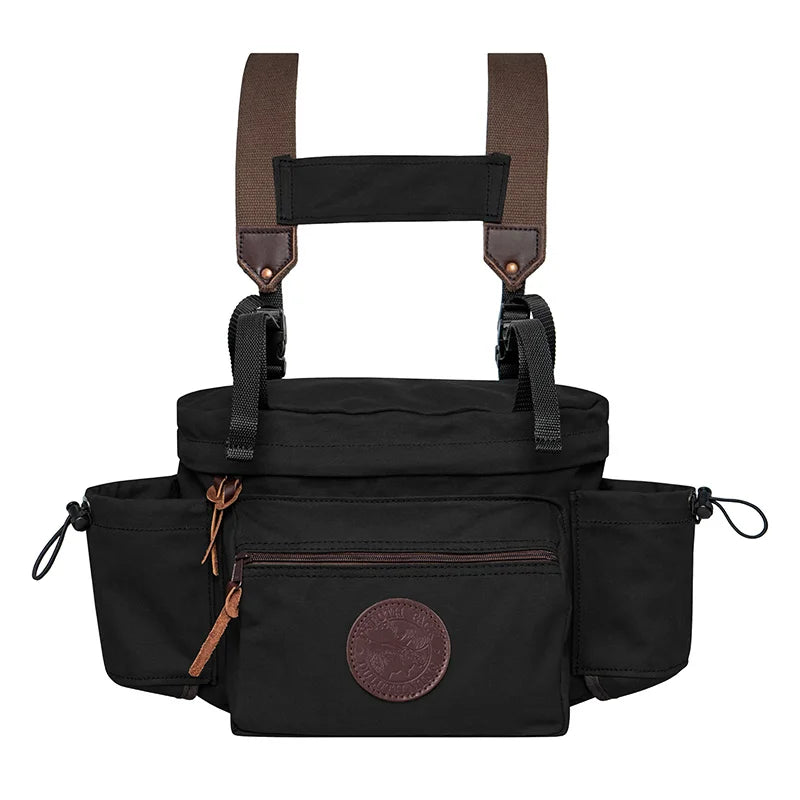 All Day Lumbar Pack in black with burly canvas and leather accents, designed by Duluth Pack for rugged outdoor use with removable straps and waterproof bottom lining.