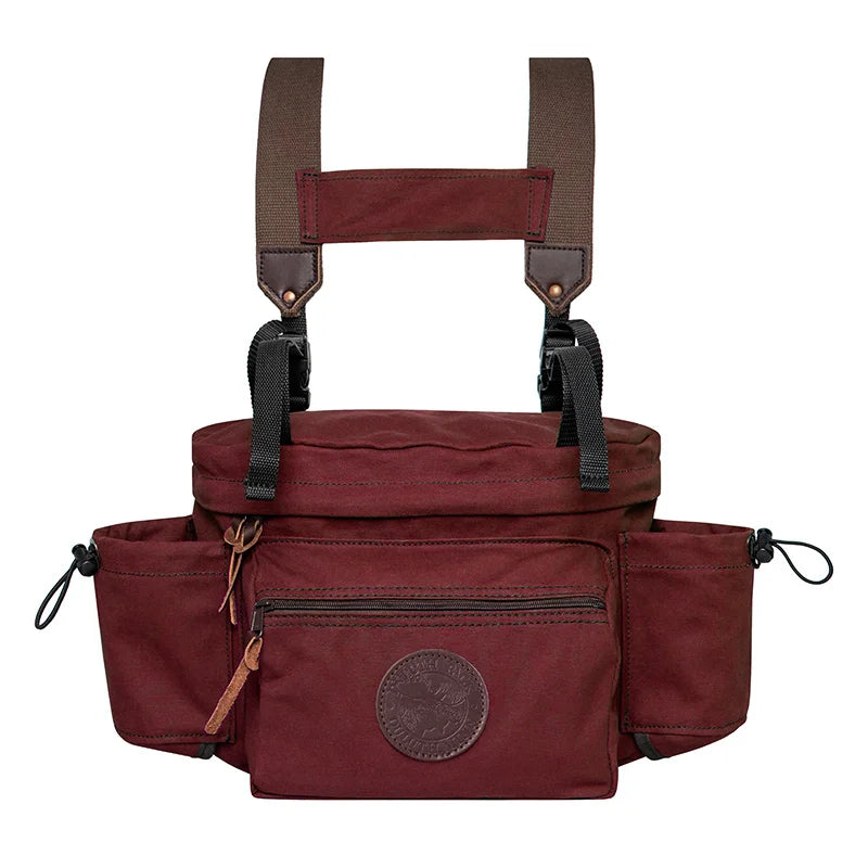 All Day Lumbar Pack in burgundy canvas with adjustable straps, designed by Duluth Pack for durable outdoor use and versatile daypack functionality.