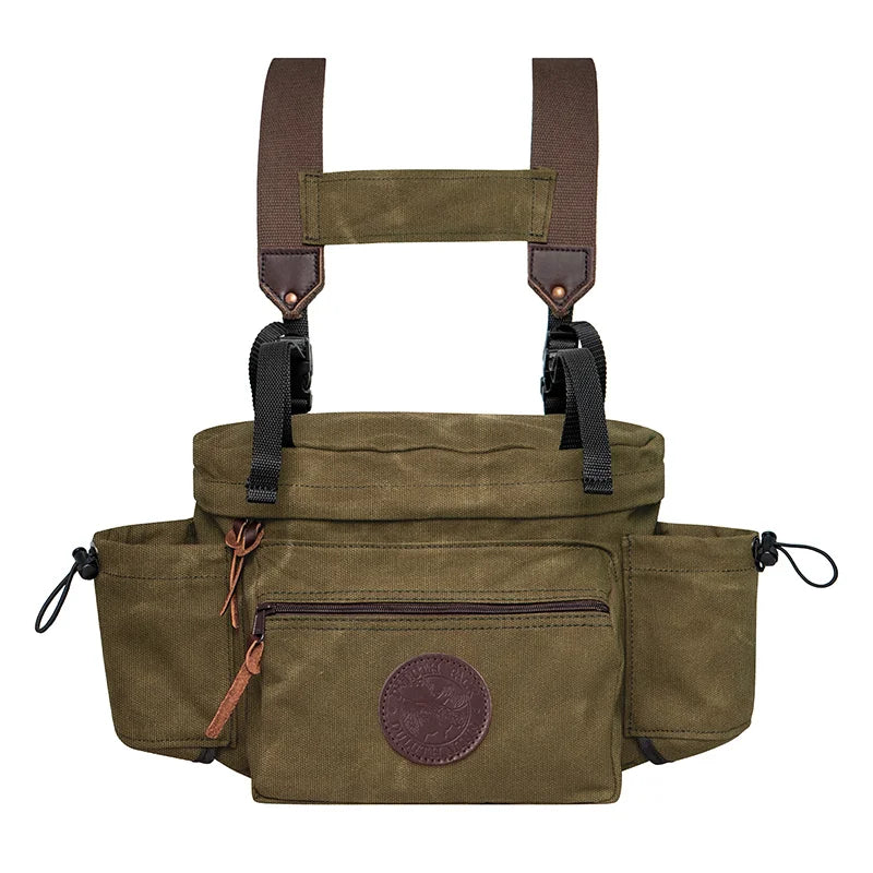 All Day Lumbar Pack in waxed olive drab canvas with removable straps, designed by Duluth Pack for rugged outdoor use and durable everyday carry.