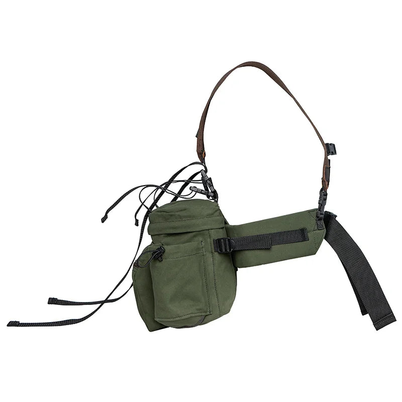 All Day Lumbar Pack in Olive Drab canvas with removable straps by Duluth Pack, designed for rugged outdoor use and durable all-day comfort.