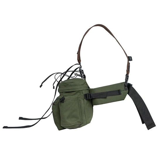 All Day Lumbar Pack in Olive Drab canvas with removable straps by Duluth Pack, designed for rugged outdoor use and durable all-day comfort.