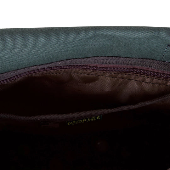 Conceal &amp; Carry Field Satchel with rugged canvas and leather interior pocket designed for secure concealment in an outdoor gear setting.