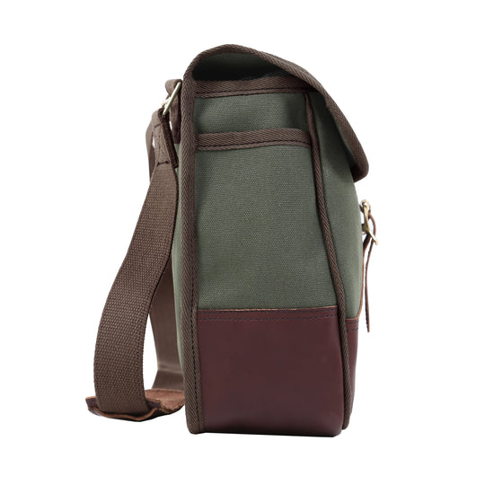 Conceal &amp; Carry Field Satchel in rugged green canvas with thick brown leather bottom and flap, designed for durable outdoor use and comfortable carry.