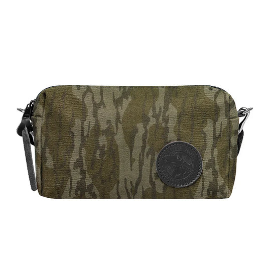 Riverwalk Purse in Mossy Oak Bottomland Camo canvas with leather patch and adjustable cotton web shoulder strap, perfect for rugged outdoor use.