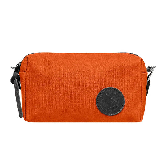 Riverwalk Purse in vibrant orange rugged 15 oz canvas with black leather patch, designed for durable everyday use and outdoor adventures by Duluth Pack.
