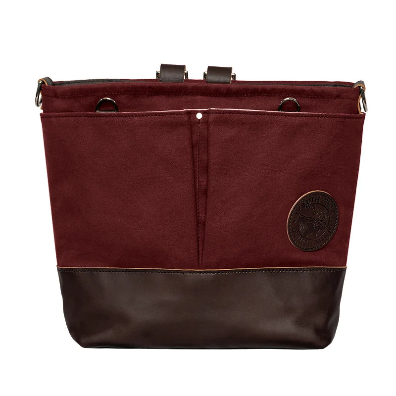 Convertible Jet-Setter Tote in burgundy with dark leather bottom, showcasing durable craftsmanship and versatile outdoor design by Duluth Pack.