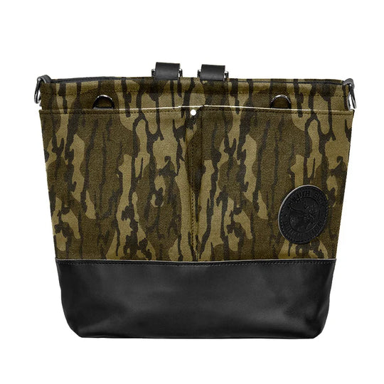 Convertible Jet-Setter Tote in Mossy Oak Bottomland Camo with black leather base, featuring durable canvas and leather craftsmanship for rugged outdoor use.