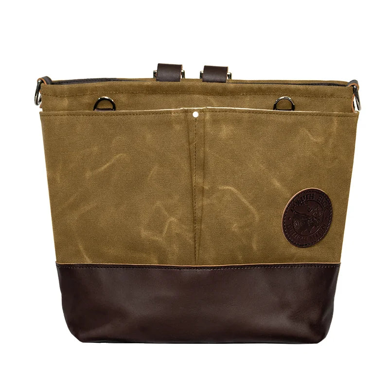 Convertible Jet-Setter Tote in waxed khaki canvas and leather, featuring durable craftsmanship from Duluth Pack for versatile outdoor and travel use.