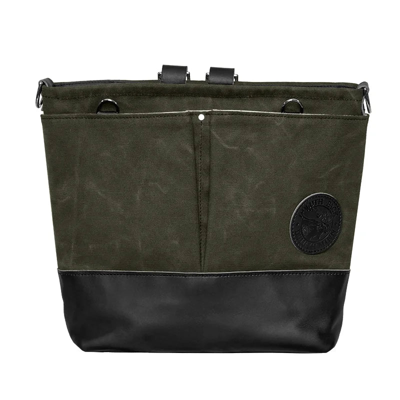Convertible Jet-Setter Tote in Waxed Olive Drab with black leather bottom, showcasing durable canvas and versatile design for rugged outdoor adventures.