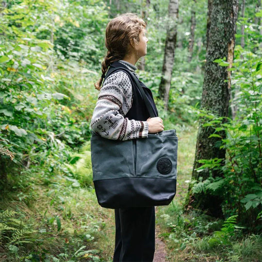 Convertible Jet-Setter Tote over shoulder of model on hiking trail
