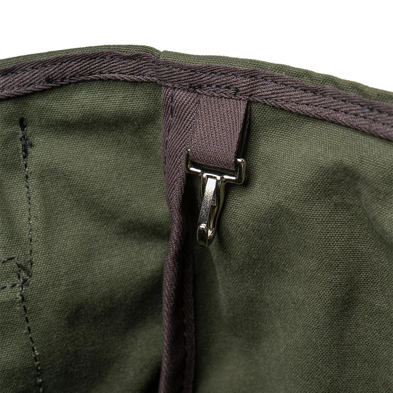 Highlander Tote interior clip detail in olive drab canvas, showcasing durable craftsmanship for secure key attachment by Duluth Pack.