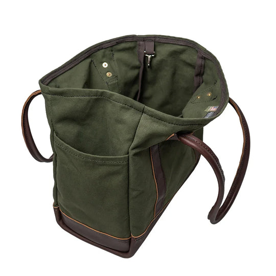 Highlander Tote in olive drab with leather handles, featuring a spacious waxed canvas interior and an interior clip for keys, designed for durable outdoor use.