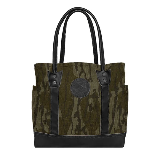 Highlander Tote in Mossy Oak Bottomland Camo with black leather accents, a durable handmade canvas tote perfect for rugged outdoor use and everyday carry by Duluth Pack.