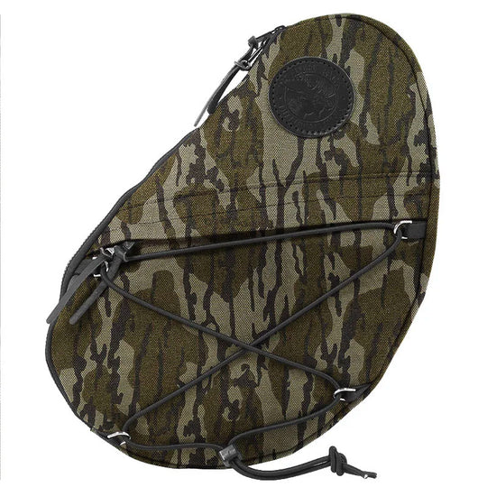 Sling Pack in Mossy Oak Bottomland Camo crafted from durable canvas, featuring external bungee cords for versatile outdoor use by Duluth Pack.